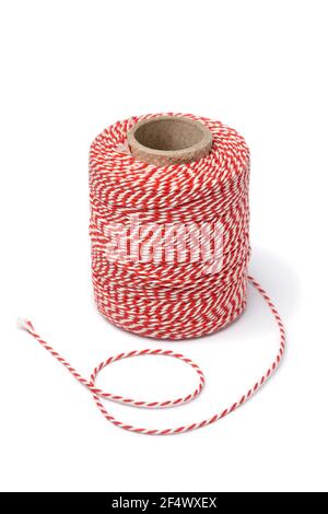 Roll of red and white cotton Butcher's Twine isolated on white background Stock Photo