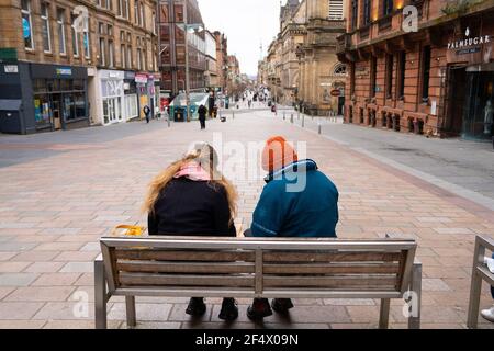 Glasgow, Scotland, UK. 23 March 2021. On the first anniversary of the coronavirus pandemic lockdown the streets in Glasgow city centre are still quiet with only essential shops open. Pic; Buchanan Street is very quiet. Iain Masterton/Alamy Live News Stock Photo