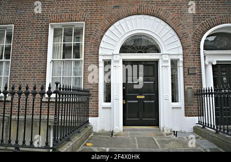 Georgian style old brick building facade with an arched  entrance door on Merrion Square Dublin, Ireland. Stock Photo