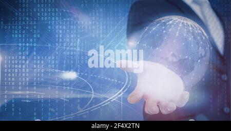 Composition of binary coding and network of digital icons forming globe over hand of businessman Stock Photo