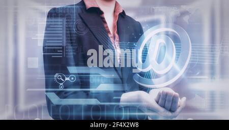 Composition of email digital icon and data processing over hand of businesswoman Stock Photo