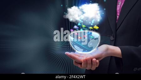 Composition of network of digital icons with globe and cloud over hands of businessman Stock Photo