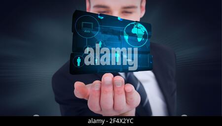 Composition of network of digital icons with globe on digital screen over hand of businessman Stock Photo