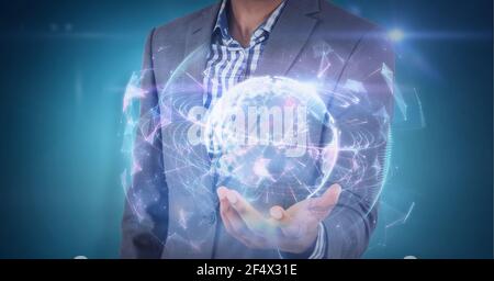 Composition of network of connections with glowing globe over hand of businessman Stock Photo