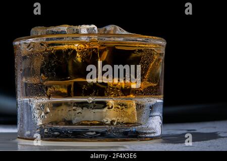 Refreshing Jamaican Rum Drink with ice up close Stock Photo