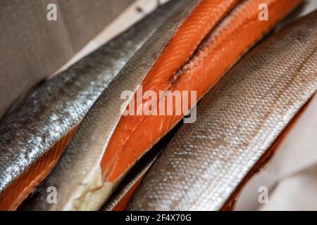 Smoked fish in craft paper box. Ready for delivery production. Smoked fish production concept Stock Photo