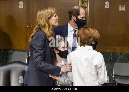 Former US Ambassador to the United Nations Samantha Power (L) greets her daughter Rian Power Sunstein (C-L), husband Cass Sunstein (C-R), and son Declan Power Sunstein (R) after she testified before the Senate Foreign Relations Committee to be the next Administrator of the United States Agency for International Development (USAID) in the Dirksen Senate Office Building in Washington DC, USA, 23 March 2021. Washington, DC, USA. Photo by Jim Lo Scalzo/Pool/ABACAPRESS.COM Stock Photo