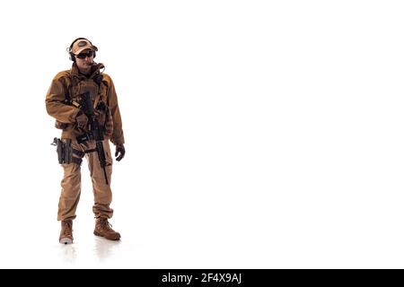 portrait of a man military outfit a mercenary soldier in modern times on a white background in studio Stock Photo