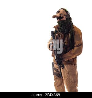 portrait of a man military outfit a mercenary soldier in modern times on a white background in studio Stock Photo