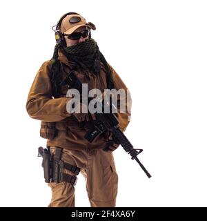 portrait of a man military outfit a mercenary soldier in modern times on a white background in studio Stock Photo