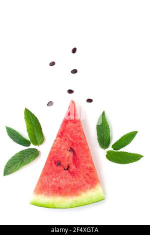 Slice of watermelon with seeds and mint leaves isolated on white background. Summer concept Stock Photo