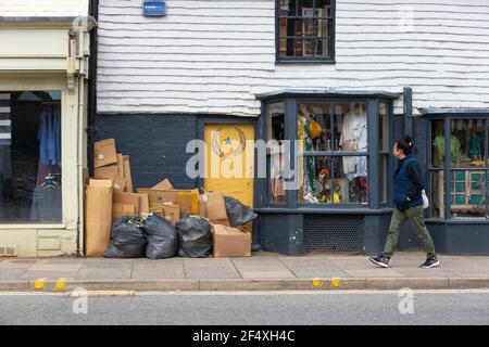 Commercial rubbish, waste piled up outside high street shop, tenterden, kent, uk Stock Photo