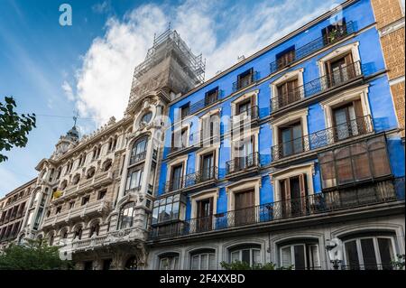 Facades of buildings on the Gran Via in Madrid in Castile, Spain Stock Photo