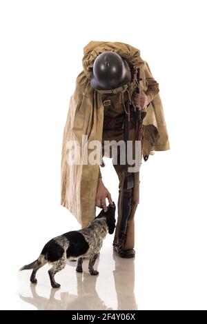 Male actor in the form of ordinary soldiers of the Russian army in the period 1939-1940, with the Tokarev Self-loading rifle on a white background in Stock Photo