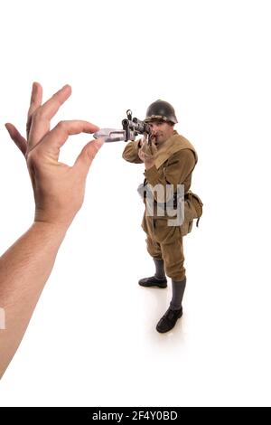 Male actor in the form of ordinary soldiers of the Russian army in the period 1939-1940, with the Tokarev Self-loading rifle on a white background in Stock Photo