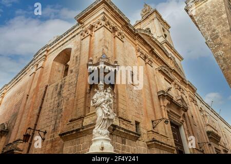 Statue of a Madonna and Child Jesus, on the corner of an old street, in Mdina in the center of the island of Malta Stock Photo