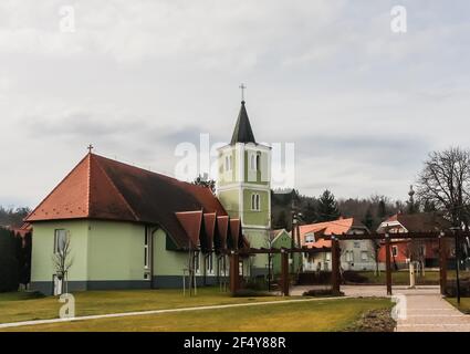 A local attraction: The church of the Heart of Jesus, modern nave and old belfry, Heviz, Egregy village, Hungary Stock Photo