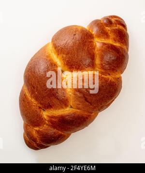 Easter sweet bread, tsoureki cozonac loaf slices isolated on white background, top view. Braided brioche, challah. Festive traditional religion desser Stock Photo
