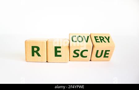 Recovery and rescue symbol. Turned cubes and changed the word 'recovery' to 'rescue'. Beautiful white background. Business and recovery - rescue conce Stock Photo