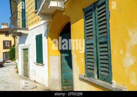 Gaggiano (Milan, Lombardy, Italy), historic town with colorful buildings along the Naviglio Grande, at summer Stock Photo