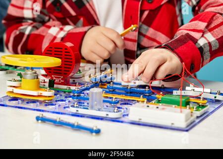 children playing with electronic constructor at studio Stock Photo