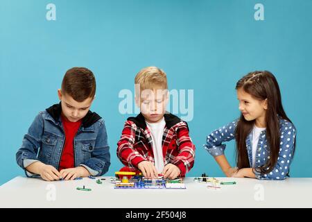 children playing with electronic constructor at studio Stock Photo