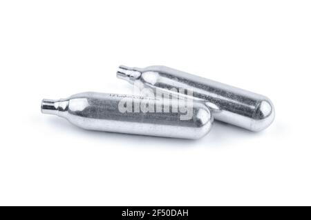 Two Aluminum CO2 Balloon for Air Gun Isolated on White Background. The Co2 Cartridges. Stock Photo