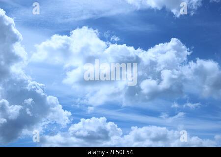 blue sky with white fluffy clouds Stock Photo
