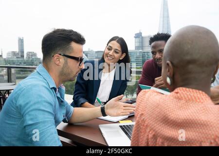 Business people meeting on urban office balcony, London, UK Stock Photo