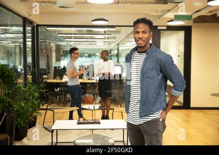 Portrait confident casual businessman in office Stock Photo
