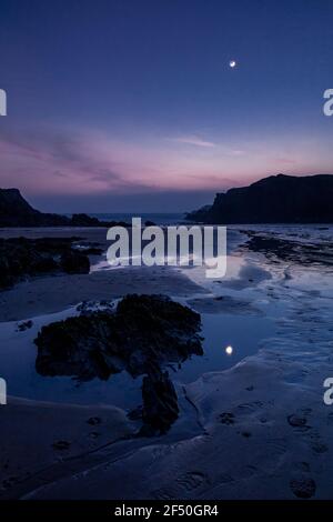 Trearddur Bay at low tide at dusk, Anglesey, North Wales Stock Photo