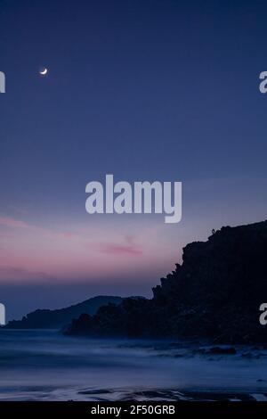 Trearddur Bay at low tide at dusk, Anglesey, North Wales Stock Photo