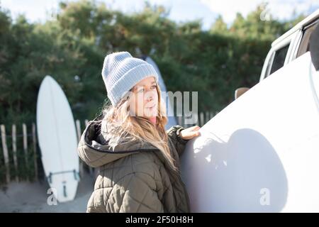 Young female surfer with surfboard Stock Photo