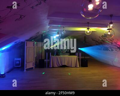 Krakow, Poland - December 14, 2019: An empty dance floor with illuminated colorful disco spot lights. ready for a dance party and celebration and a di Stock Photo