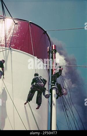 Bordle life. Two sailors, wired when working on the ship chimney (on the Cap Arcona or Monte Rosa) Stock Photo