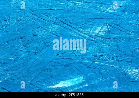 Blue painted background of wood panels, oriented strand board - OSB wood. Board for the attic. Stock Photo