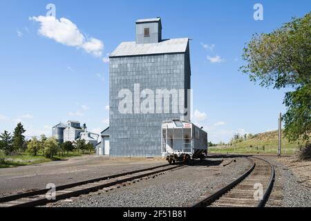This grain elevator was destroyed by fire on October 22, 2019, six months after this picture was captured - Winona Washington with nearby rail tracks Stock Photo