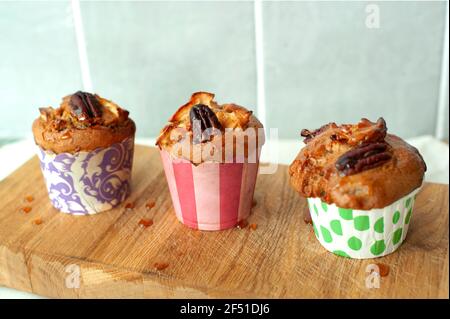 Close-up of homemade, vegan and gluten-free apple cinnamon muffins with pecans. Stock Photo