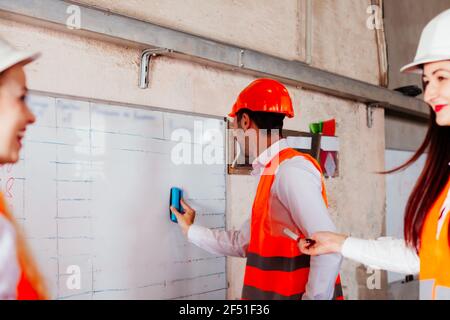 The young engineers are practicing at the factory Stock Photo