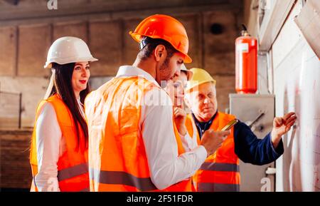 The engineers enjoy the work at the enterprise Stock Photo