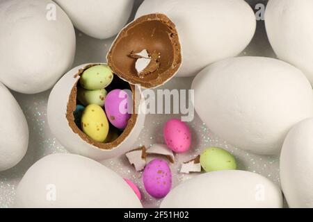 Chocolate Egg Filled With Colorful Speckled Candy Eggs Stock Photo