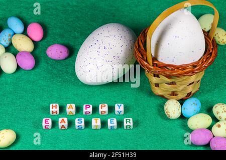 Happy Easter Speckled Candy Eggs With Weave Basket Stock Photo