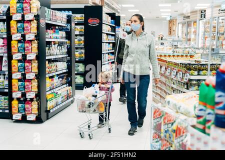 Budva, Montenegro - 17 march 2021: A child with a small trolley in the  supermarket, go shopping with his mother. The family goes shopping Stock  Photo - Alamy