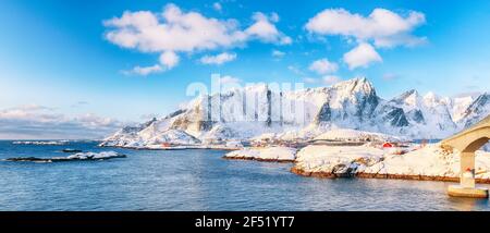 Fabulous winter view of Reine and Sakrisoya villages  seen from Hamnoy and snowy mountaines in background .  Location: Olenilsoya island, Lofoten; Nor Stock Photo
