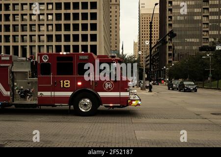 Dallas, TX, USA - 09 05 2020: Fire Truck driving into an intersection in downtown Dallas Stock Photo