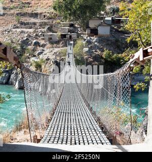 rope hanging suspension bridge in Nepal Stock Photo