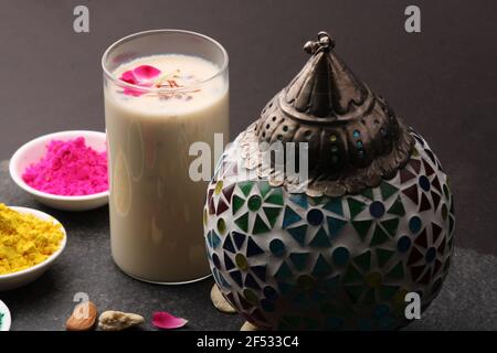 Indian festival Holi concept - Traditional Indian beverage Thandai Sardai milk festival food, with nuts and color in bowl. Stock Photo