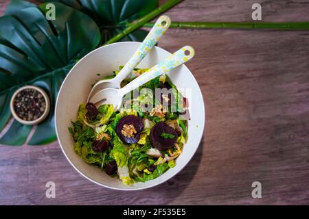 Salad bowl with Beetroots lettuce Walnut top view Stock Photo
