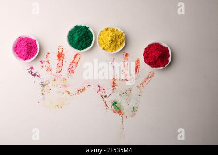 Holi greetings - Organic Gulal  in bowl for festival of colors Stock Photo