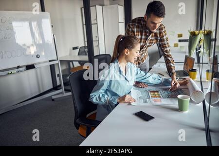 Engineer and his coworker creating a technical drawing Stock Photo